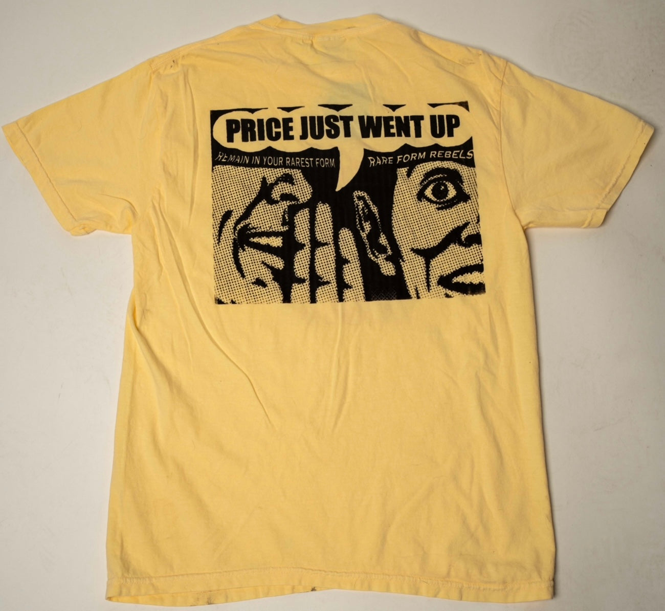 YELLOW RARE FORM REBELS PRICE IS UP TEE